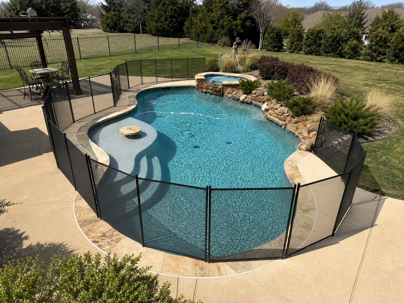Lagoon-style pool with rock waterfall spa