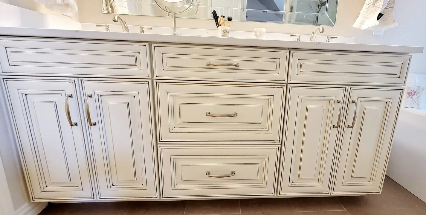Plano bathroom remodel: antique-finish double vanity with quartz counter